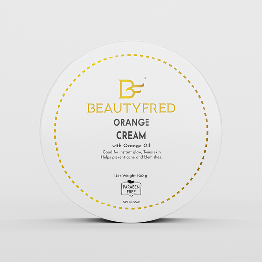 A jar of 'Beauty Fred Orange Cream' with orange oil, designed for skin care, highlighting its natural ingredients and benefits.