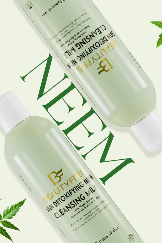 Two bottles of BEAUTYFILE cleansing milks with neem leaves on a white background