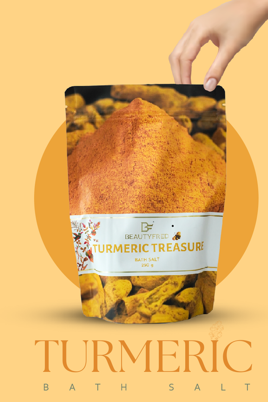 Turmeric bath salt package with a hand holding it against an orange background