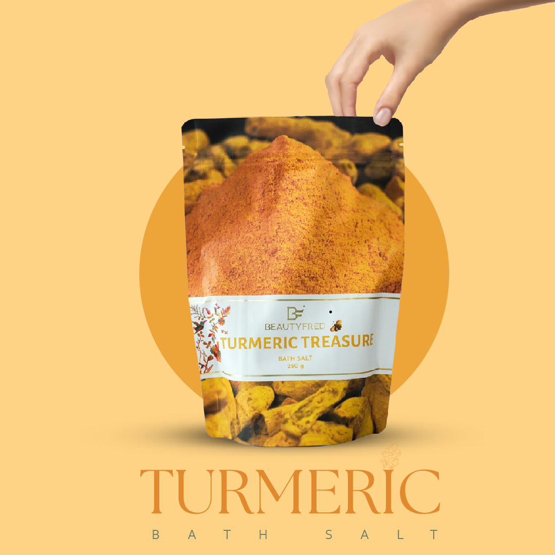 Turmeric bath salt package with a hand holding it against an orange background